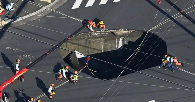 Swimming pool-sized sinkhole swallows truck in Japan, trapping driver inside 